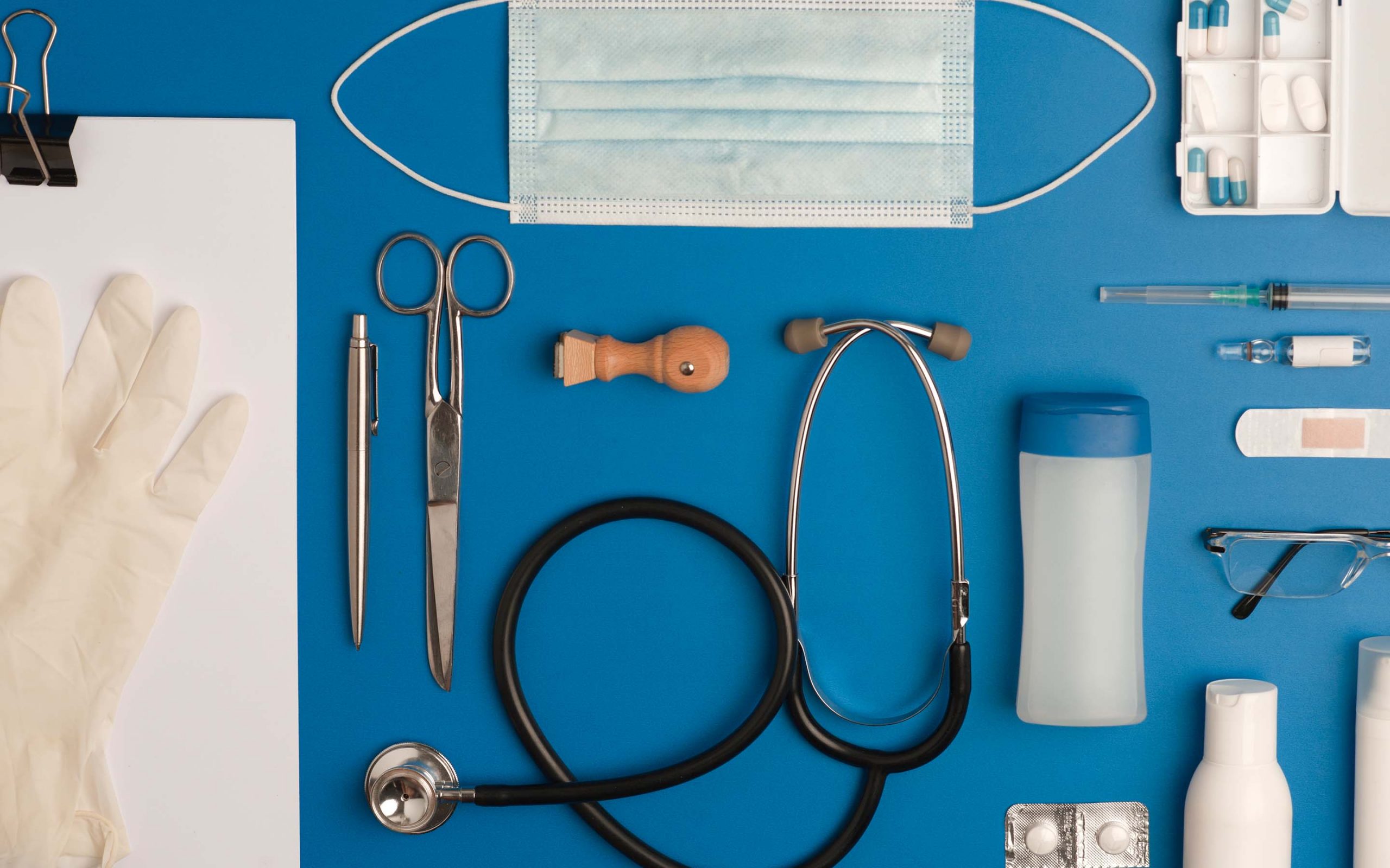 Close up of clinical tools and patient chart materials.